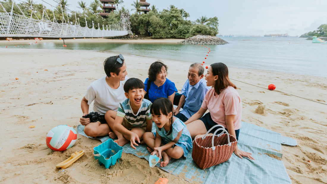 Family enjoying beach day with kids in Singapore”