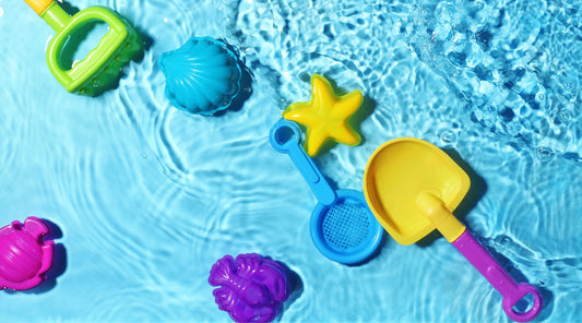 Beach toys being washed in clean water