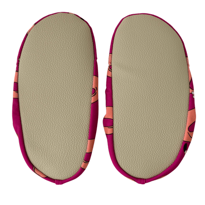 Pair of beige grip soles on a transparent background.