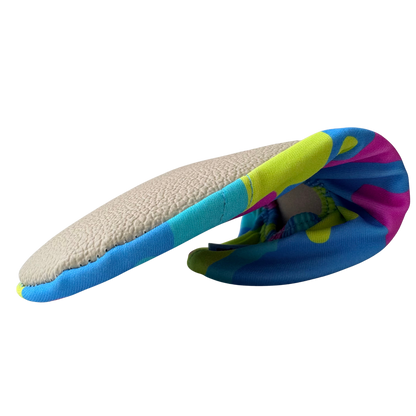 Folded non-slip water socks with colorful ice cream pattern and beige grip sole on a transparent background.