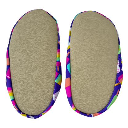 Pair of beige grip soles on a transparent background.