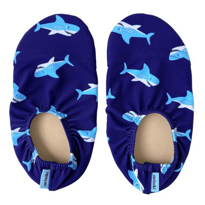 Pair of navy blue non-slip water socks with shark pattern on a transparent background.