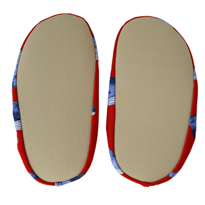Pair of beige grip soles on a transparent background.