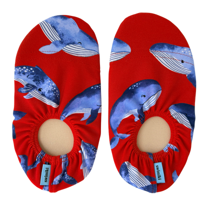 Red non-slip water socks with blue whale pattern on a transparent background.